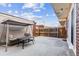 Backyard patio with a swing and outdoor furniture that provides a relaxing outdoor space to unwind and entertain at 625 S Xenon Ct, Lakewood, CO 80228
