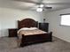 Spacious bedroom featuring carpet, a ceiling fan, and traditional furnishings at 625 S Xenon Ct, Lakewood, CO 80228