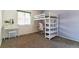 Cozy bedroom with loft bed, a desk, and plenty of natural light at 625 S Xenon Ct, Lakewood, CO 80228