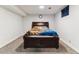 Basement bedroom with carpet and dark wood furniture at 625 S Xenon Ct, Lakewood, CO 80228