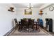 Dining room featuring wood table, seating for six, and decorative rug at 625 S Xenon Ct, Lakewood, CO 80228