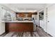 Modern kitchen with stainless steel appliances, island, and pantry with a laundry area at 625 S Xenon Ct, Lakewood, CO 80228