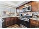 Updated kitchen featuring stainless steel appliances and ample countertop space at 625 S Xenon Ct, Lakewood, CO 80228