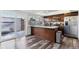 Bright kitchen with stainless appliances, modern countertops and a sliding glass door at 625 S Xenon Ct, Lakewood, CO 80228