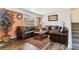 Comfortable living room showcasing hardwood floors and a large window with stylish shutters at 625 S Xenon Ct, Lakewood, CO 80228