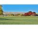 Expansive park with colorful autumn trees in a landscaped area providing a serene outdoor space to enjoy at 625 S Xenon Ct, Lakewood, CO 80228