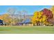 Colorful playground and park with trees and slides, offering a vibrant and engaging space for children to play at 625 S Xenon Ct, Lakewood, CO 80228