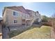 Back of home with deck and stairs with a large backyard featuring low maintenance landscaping at 24437 E Powers Ave, Aurora, CO 80016
