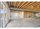 Unfinished basement with rough-in plumbing and sliding door for natural light at 24437 E Powers Ave, Aurora, CO 80016