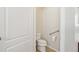 Neutral bathroom with modern toilet, flooring and hand rail at 24437 E Powers Ave, Aurora, CO 80016