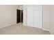 Comfortable bedroom with neutral carpeting and a closet offers a calming retreat at 24437 E Powers Ave, Aurora, CO 80016