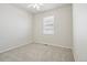 This bedroom features neutral walls, carpeted floors, a ceiling fan, and a single window at 24437 E Powers Ave, Aurora, CO 80016