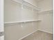 Walk-in closet with carpet and white metal shelving on all walls at 24437 E Powers Ave, Aurora, CO 80016