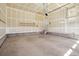 Attached garage with high ceilings and concrete floors at 24437 E Powers Ave, Aurora, CO 80016