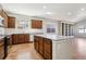 Well-equipped kitchen showcases a granite island, stainless appliances, and ample cabinet space at 24437 E Powers Ave, Aurora, CO 80016