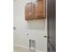 Laundry room with overhead cabinets and hookups for a washer and dryer at 24437 E Powers Ave, Aurora, CO 80016