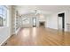 Spacious living room with gleaming hardwood floors, built-in bookshelves, and a cozy fireplace at 24437 E Powers Ave, Aurora, CO 80016