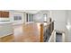 Bright living room with hardwood floors, large windows, and stylish built-in shelving at 24437 E Powers Ave, Aurora, CO 80016