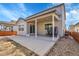 An inviting backyard with a covered patio and ample space for outdoor enjoyment on a sunny day at 3310 Quicksilver Rd, Frederick, CO 80516