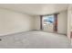 Large bedroom with carpet, neutral walls, and bright natural light at 3310 Quicksilver Rd, Frederick, CO 80516