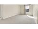 Spacious bedroom with carpeted floors and a sunlit window at 3310 Quicksilver Rd, Frederick, CO 80516