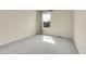 Bright bedroom featuring neutral walls, carpet, large window with curtain at 3310 Quicksilver Rd, Frederick, CO 80516