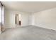 Spacious bedroom with plush carpet and access to a private bathroom at 3310 Quicksilver Rd, Frederick, CO 80516