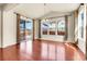 Bright dining room features hardwood floors, vaulted ceiling, and sliding door to the backyard at 3310 Quicksilver Rd, Frederick, CO 80516