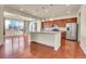 Beautiful open kitchen features stainless steel appliances, granite countertops, and a center island at 3310 Quicksilver Rd, Frederick, CO 80516