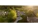 Stunning aerial view of home with mature trees and circle driveway at 4935 E Preserve Ln, Greenwood Village, CO 80121