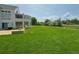 Lush green backyard with stone patio and landscaping, perfect for outdoor enjoyment at 4935 E Preserve Ln, Greenwood Village, CO 80121