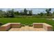 Beautiful green backyard with stone seating area and well-manicured landscaping at 4935 E Preserve Ln, Greenwood Village, CO 80121