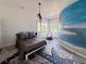 Whimsical room with mural accent wall, teepee tent, and a modern hanging light at 4935 E Preserve Ln, Greenwood Village, CO 80121