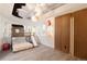 Playful bedroom with a custom loft bed, slide, unique mural, and built-in storage at 4935 E Preserve Ln, Greenwood Village, CO 80121