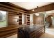 Bright walk-in closet boasts custom wood shelving, drawers, and a spacious center island at 4935 E Preserve Ln, Greenwood Village, CO 80121
