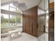 Unique dressing room features a vaulted ceiling, statement lighting and custom storage at 4935 E Preserve Ln, Greenwood Village, CO 80121