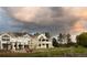 Lovely home with a large backyard, exterior staircase and covered patio at 4935 E Preserve Ln, Greenwood Village, CO 80121