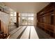 Bright and open living room with hardwood floors and built-in shelving at 4935 E Preserve Ln, Greenwood Village, CO 80121
