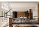 Open-concept living room boasts balcony and geometric wall design at 4935 E Preserve Ln, Greenwood Village, CO 80121