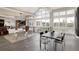 Open-concept living and dining area with contemporary furnishings and ample natural light at 4935 E Preserve Ln, Greenwood Village, CO 80121