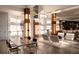 Bright living room featuring soaring ceilings and wood columns at 4935 E Preserve Ln, Greenwood Village, CO 80121