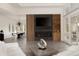 Spacious living room with fireplace, modern decor, and large windows for natural light at 4935 E Preserve Ln, Greenwood Village, CO 80121