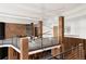 Open loft area with modern railing, geometric wood wall, and contemporary lighting at 4935 E Preserve Ln, Greenwood Village, CO 80121
