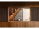 Unique wood staircase design with vertical slat details and modern lighting at 4935 E Preserve Ln, Greenwood Village, CO 80121