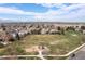 Scenic aerial view of the neighborhood featuring a green park with a playground and walking paths at 12742 Vrain St, Broomfield, CO 80020