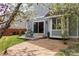 A charming backyard with a patio area, blooming trees, and well-maintained landscaping at 12742 Vrain St, Broomfield, CO 80020