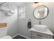 Updated half bathroom features modern vanity, vessel sink, and stylish decor at 12742 Vrain St, Broomfield, CO 80020