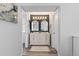 Modern bathroom features a double sink vanity with large arched mirrors and updated lighting at 12742 Vrain St, Broomfield, CO 80020