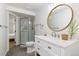 Bright bathroom with a marble countertop, modern fixtures, and a glass-enclosed shower at 12742 Vrain St, Broomfield, CO 80020