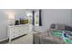 Bright bedroom featuring a dresser, large window with blinds, and comfortable bed at 12742 Vrain St, Broomfield, CO 80020